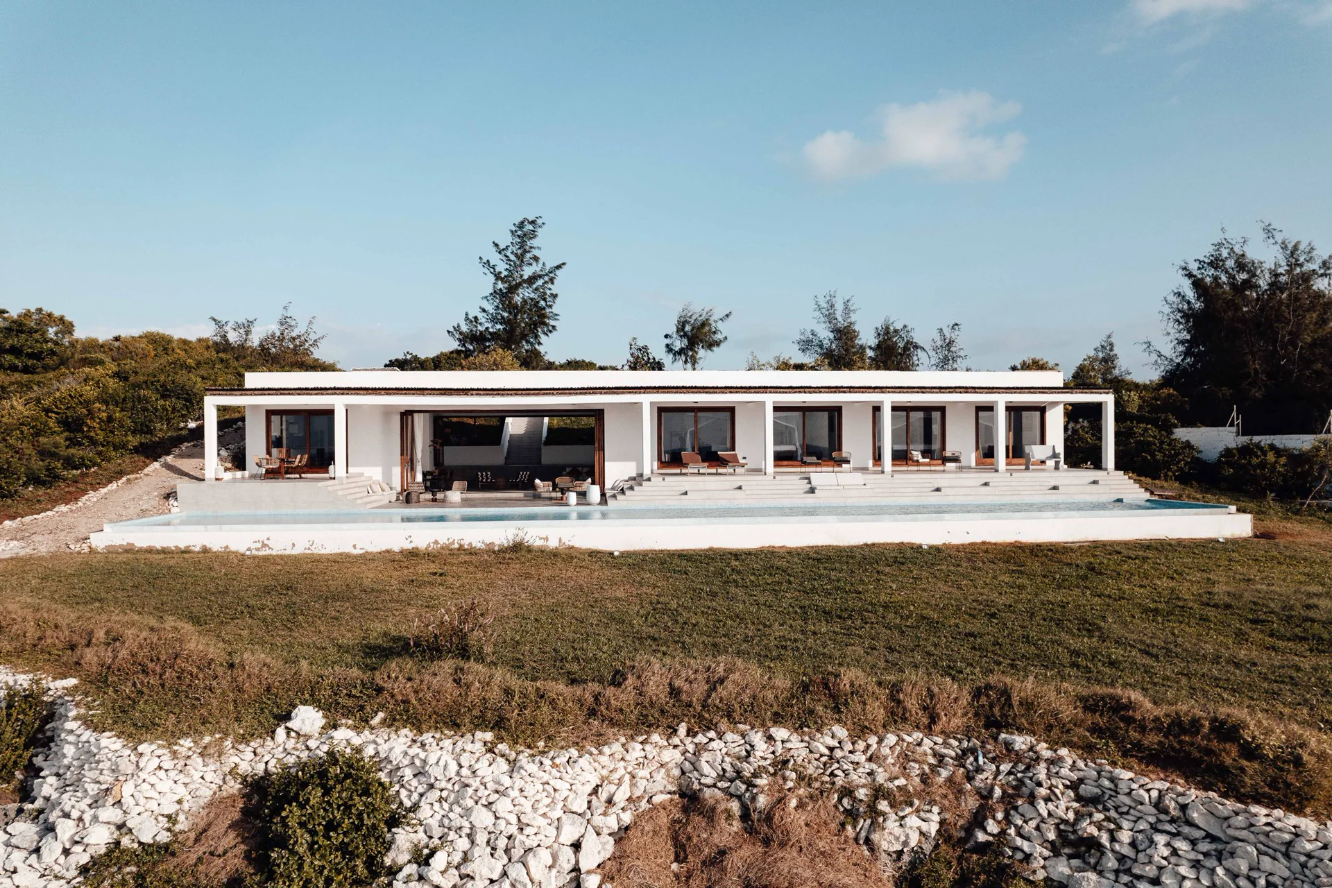 Real modern villa, pool terrace, and outdoor living environment